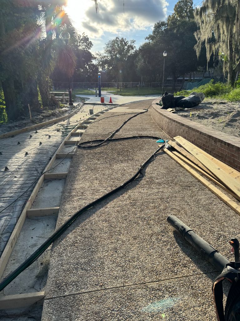 UF campus sidewalk after — beautiful exposed aggregate pebble surface, perfect match to existing campus walkways